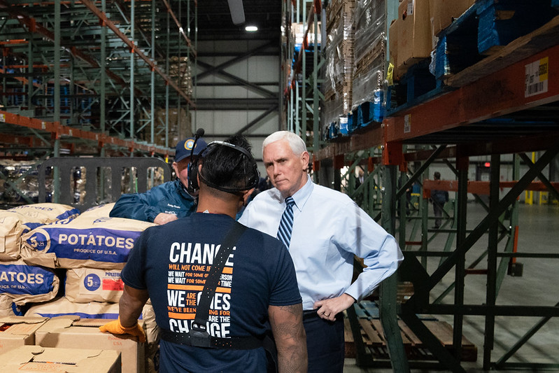 Vice President Mike Pence stops to speak to a staff member as he participates in a walking tour Wednesday, April 1, 2020, at a Walmart Distribution Center in Gordonsville, Va. (Official White House Photo by D. Myles Cullen) https://www.flickr.com/photos/whitehouse45/49741912523/in/photostream/