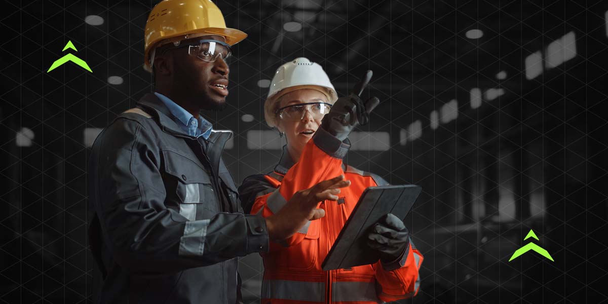 Workers analyzing safety data in a warehouse